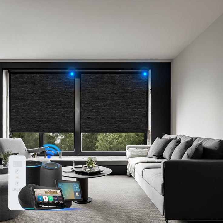 a living room filled with furniture and a window covered in black roller shade blindes