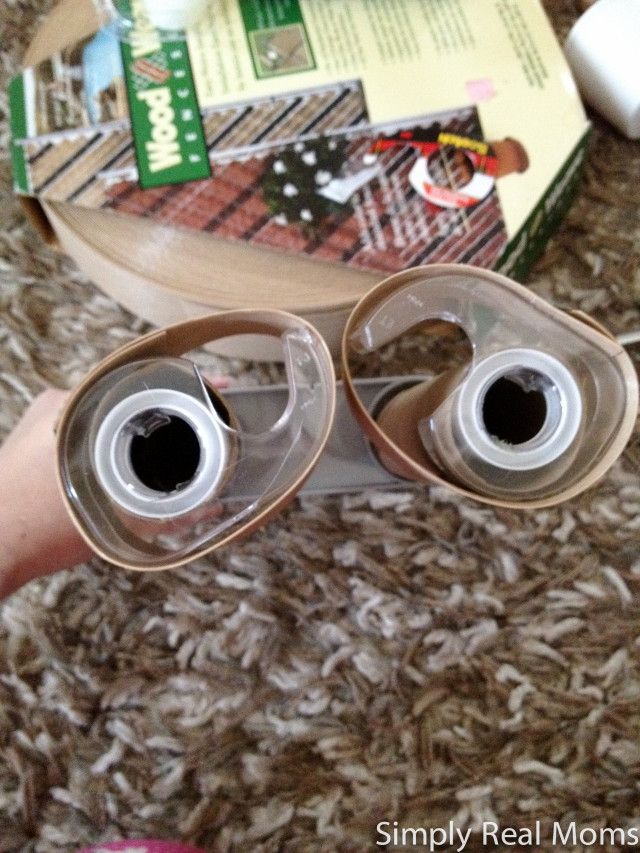 a pair of eye glasses sitting on top of a table next to a book and mouse