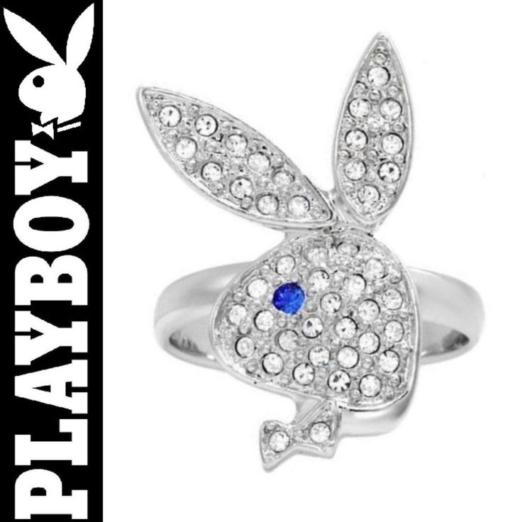 a white gold ring with blue and clear stones in the shape of a rabbit's head