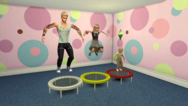 two children are playing in a room with polka dot wallpaper and colorful circles on the walls