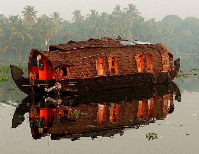 a house boat floating on top of a body of water