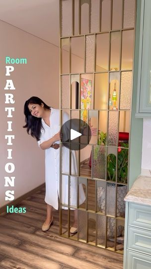 a woman standing in front of a mirror with the words room partitions on it