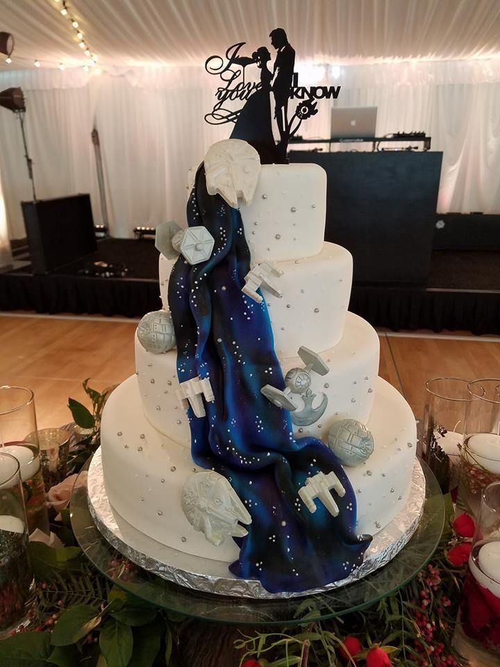 a wedding cake with blue and white frosting