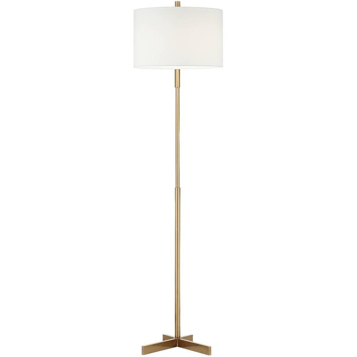 a floor lamp with a white shade on the top and a gold metal frame base