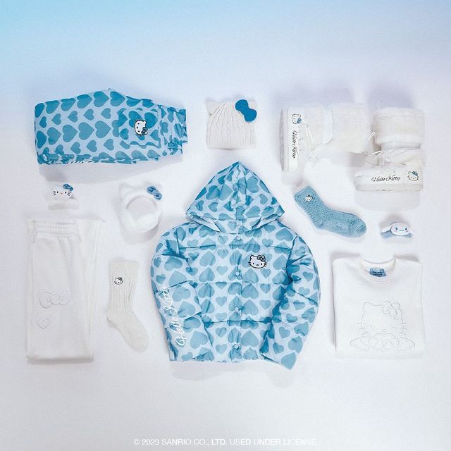 an assortment of baby items are laid out on a white surface with blue and white designs