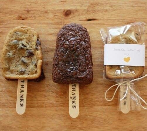 three different kinds of bread on wooden sticks