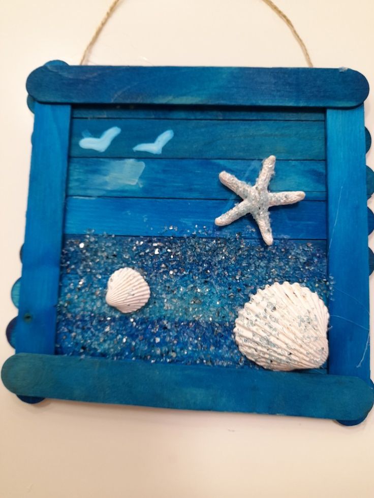 a blue frame with shells and starfish on it