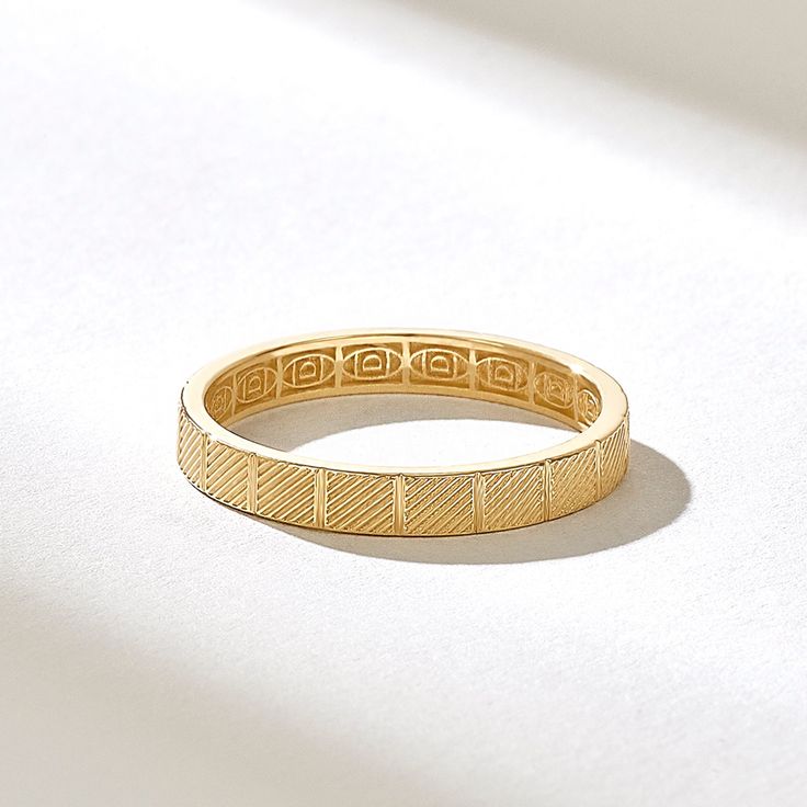 Experience the understated elegance of our Textured Square Eternity Wedding Band by Norm Jewels. This 14k Solid Gold Minimalist Band features tilted lines, creating a unique and stylish design. It's 2.80MM wide and suitable for both women and couples looking for a timeless gold band ring. Features * Made to Order. * Gold KT: 10K, 14K, 18K * Custom Gold Color: Rose Gold, Yellow Gold, White Gold * Width of Band: 2.80MM * Thickness of Band: 1.15MM * Ready to Ship in 5-7 Business Days ✓ We care about the environment,the jewelry we cast is made with recycled gold. We source exclusively post-consumer material that is refined back to their pure elements to ensure that the gold is in the same quality. Our designs are made from 14k/18k/10k real solid gold ✓ We care about customer satisfaction and l Elegant Gold Band Rings, Elegant Wedding Band For Marriage, Elegant Rings With Decorative Band For Marriage, Elegant Gold Bands For Anniversary, Gold Wedding Jewelry With Classic Design, Yellow Gold Open Band For Wedding, Elegant Wedding Band With Diamond Cut, Elegant 14k Gold Marriage Bands, Elegant Yellow Gold Bands For Marriage