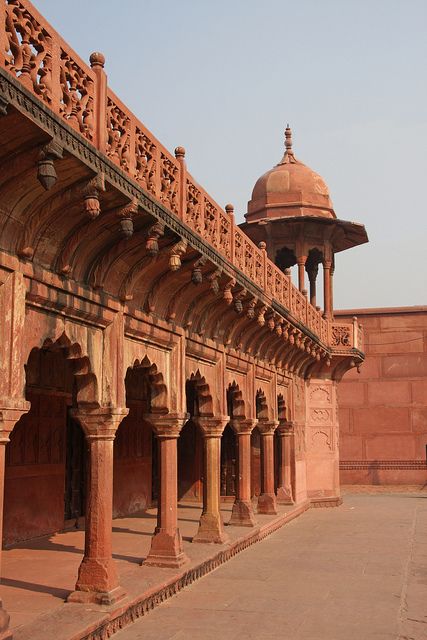 an ornate building with pillars and arches