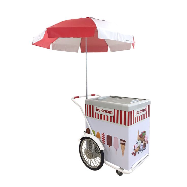 a small ice cream cart with an umbrella