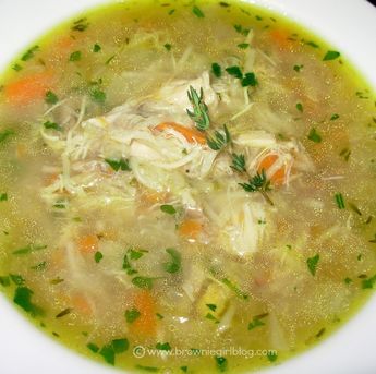 a white bowl filled with soup and vegetables