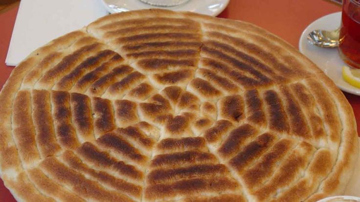 a large pancake sitting on top of a red table