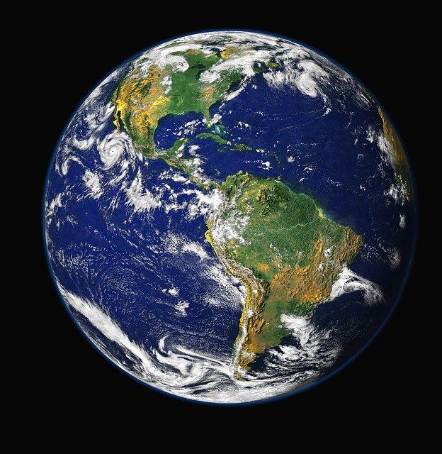 the earth from space showing africa and australia on it's side, with dark background