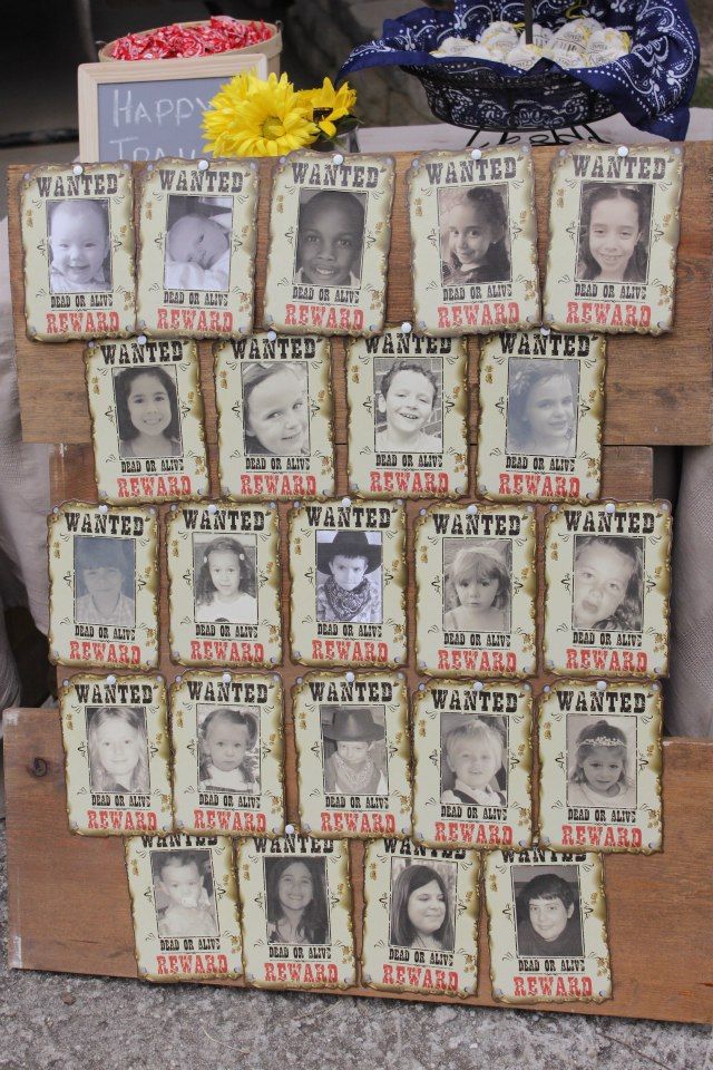 an old wooden crate with many pictures on it and a flower in the corner next to it