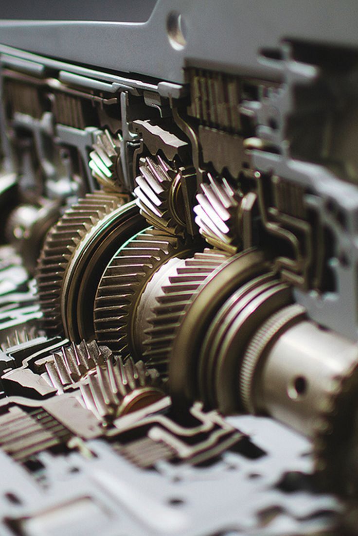 the gears and wheels of a machine are visible