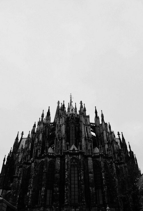 an old building with many windows and spires