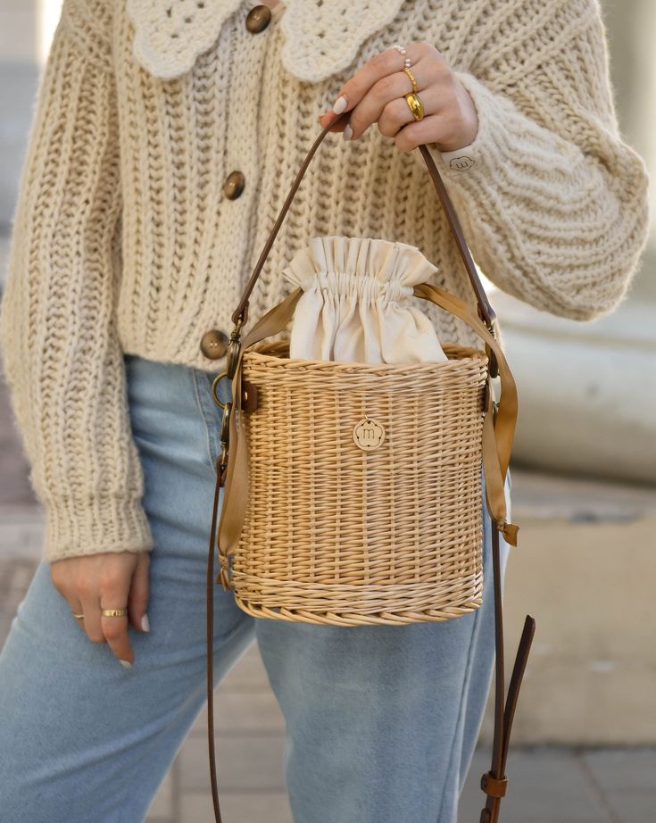 Crossbody wicker round bucket basket for women with adjustable leather long and short straps, have inside cotton bag. It is carefully hand-made by local artisans. This fashionable, stylish and environmentally-friendly basket is perfect for everyday use or going out. Basket have fantastic proportions and handle that perfectly fit into your hand. Wicker basket can be ideal gift for your mum, sister or friend! Features: - a precisely handmade basket made in Lithuania - made from all-natural, eco-fr Spring Bohemian Woven Bucket Bag, Bohemian Bucket Bag For Spring, Casual Spring Basket Bucket Bag, Bohemian Spring Bucket Bag, Trendy Straw Bucket Bag With Braided Handles, Bohemian Bucket Bag With Adjustable Strap For Spring, Chic Straw Bag For Spring Picnic, Spring Bohemian Bucket Bag With Braided Handles, Spring Bohemian Bucket Bag With Adjustable Strap