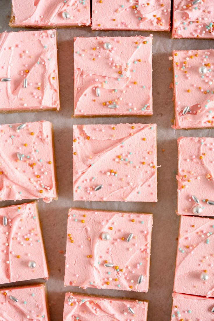 pink frosted squares with sprinkles on them