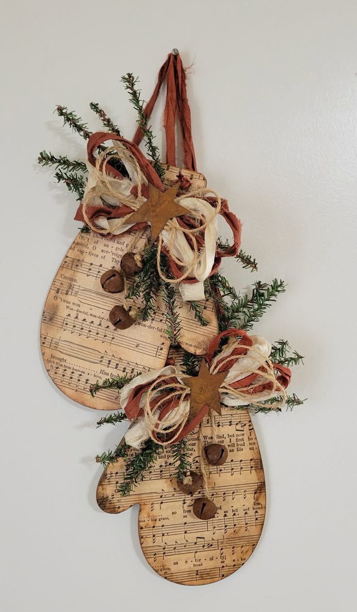 a pair of shoes hanging on a wall with sheet music notes attached to the strings