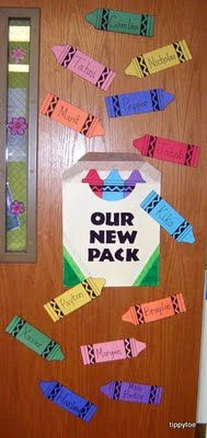 a door decorated with colorful paper clips and a sign that says our new pack on it