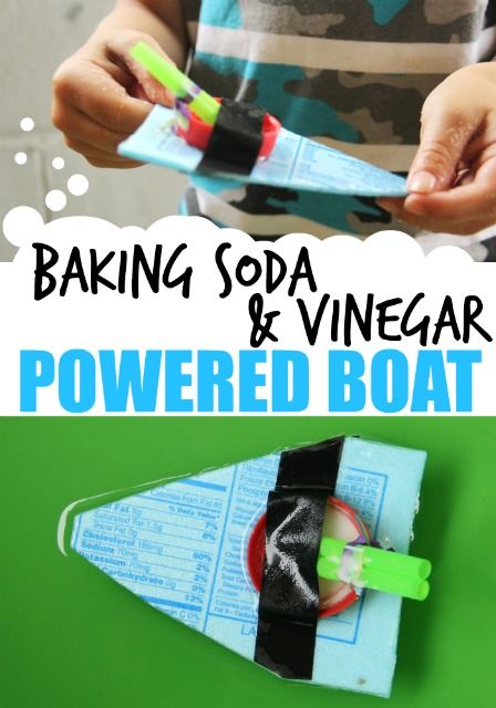 a kid is making a paper boat out of soda vinegar and powered toothbrushes