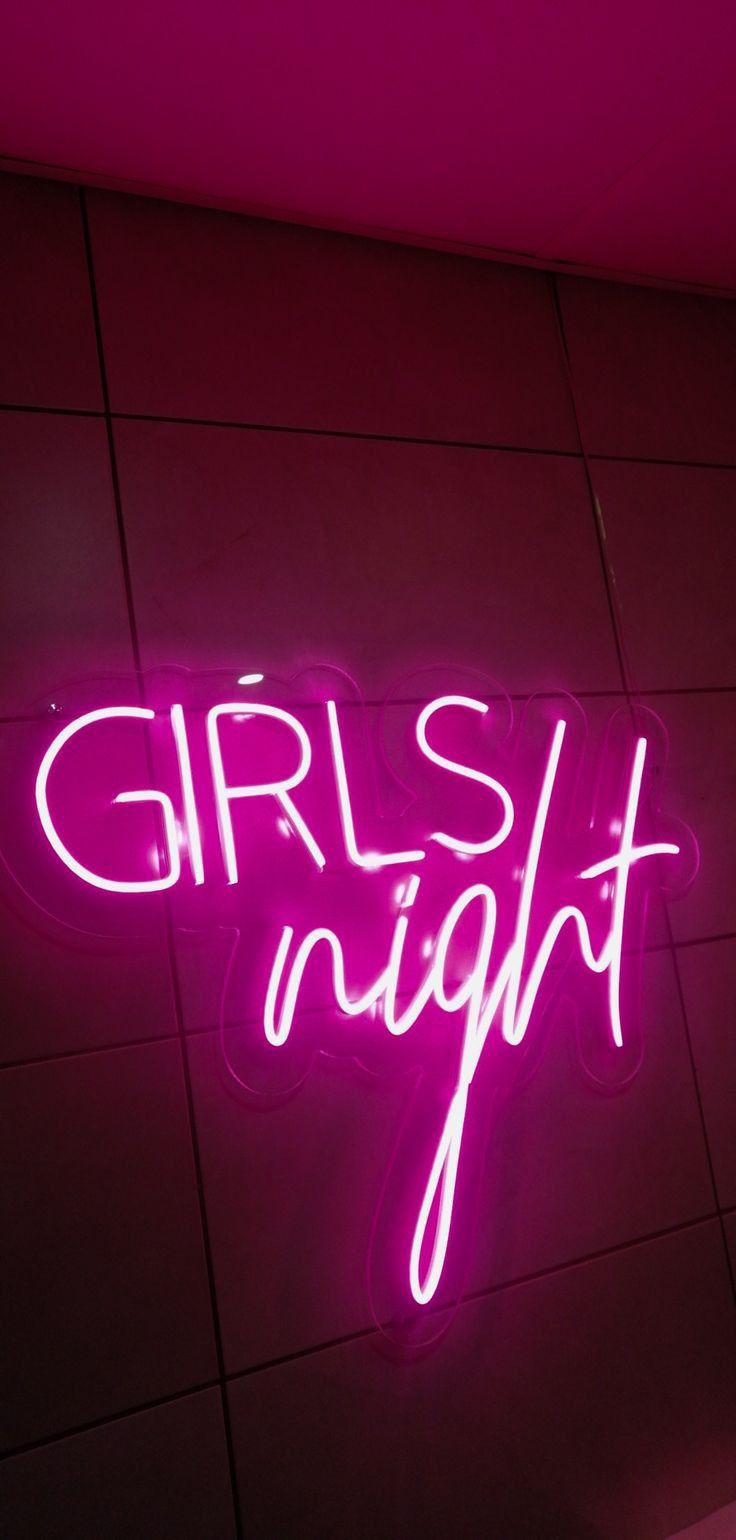 a neon sign that says girls night on the wall