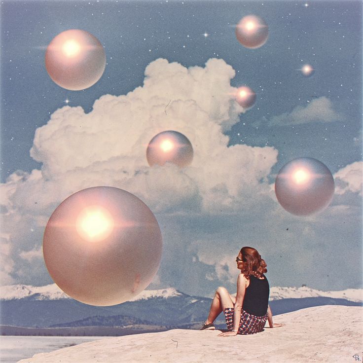 a woman sitting on top of a sandy beach under a sky filled with bubbles and stars