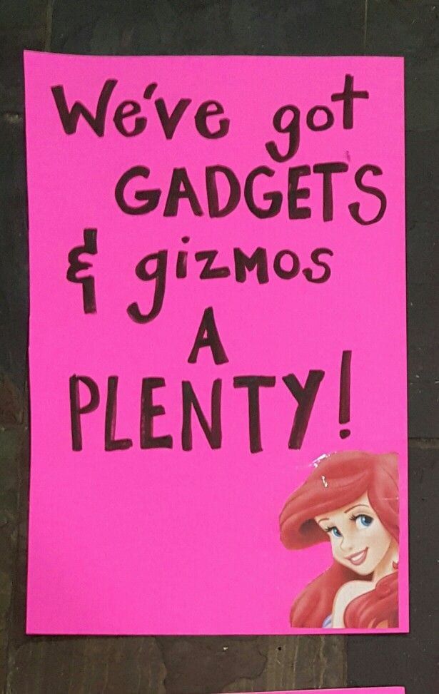 a pink sign with the words we've got gadgets and gizmos, a plenty