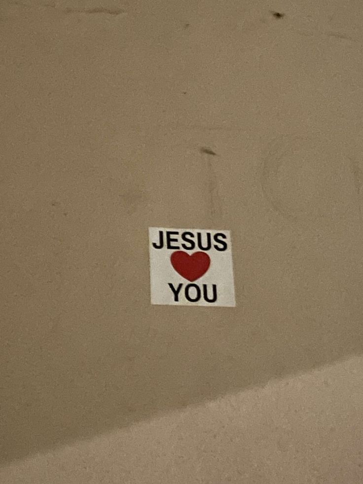 a sticker that says jesus loves you