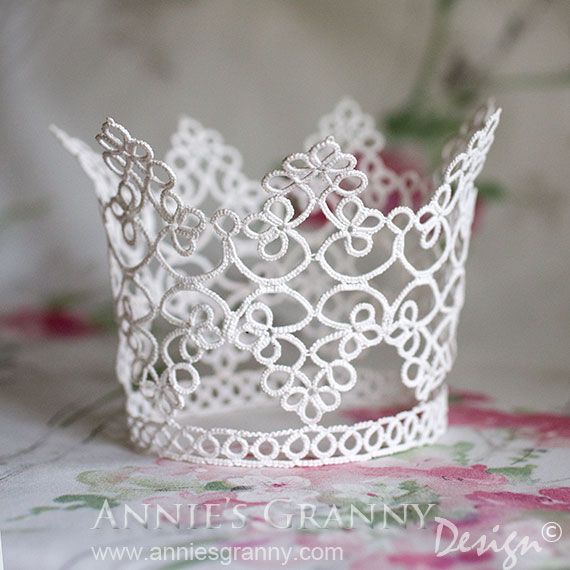 a white lace crown sitting on top of a table