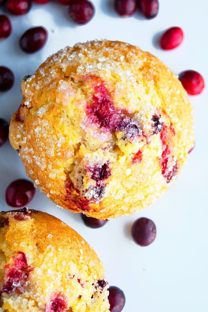 two cranberry muffins sitting next to each other