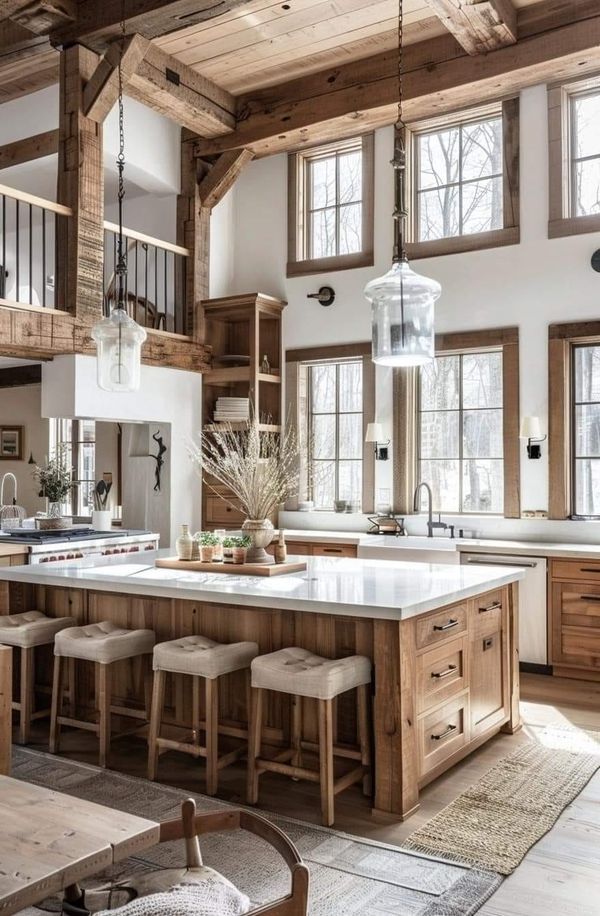 a large kitchen with lots of wooden cabinets and counter space, along with an island in the middle