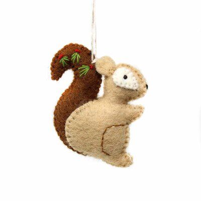 a felt squirrel ornament hanging from a string