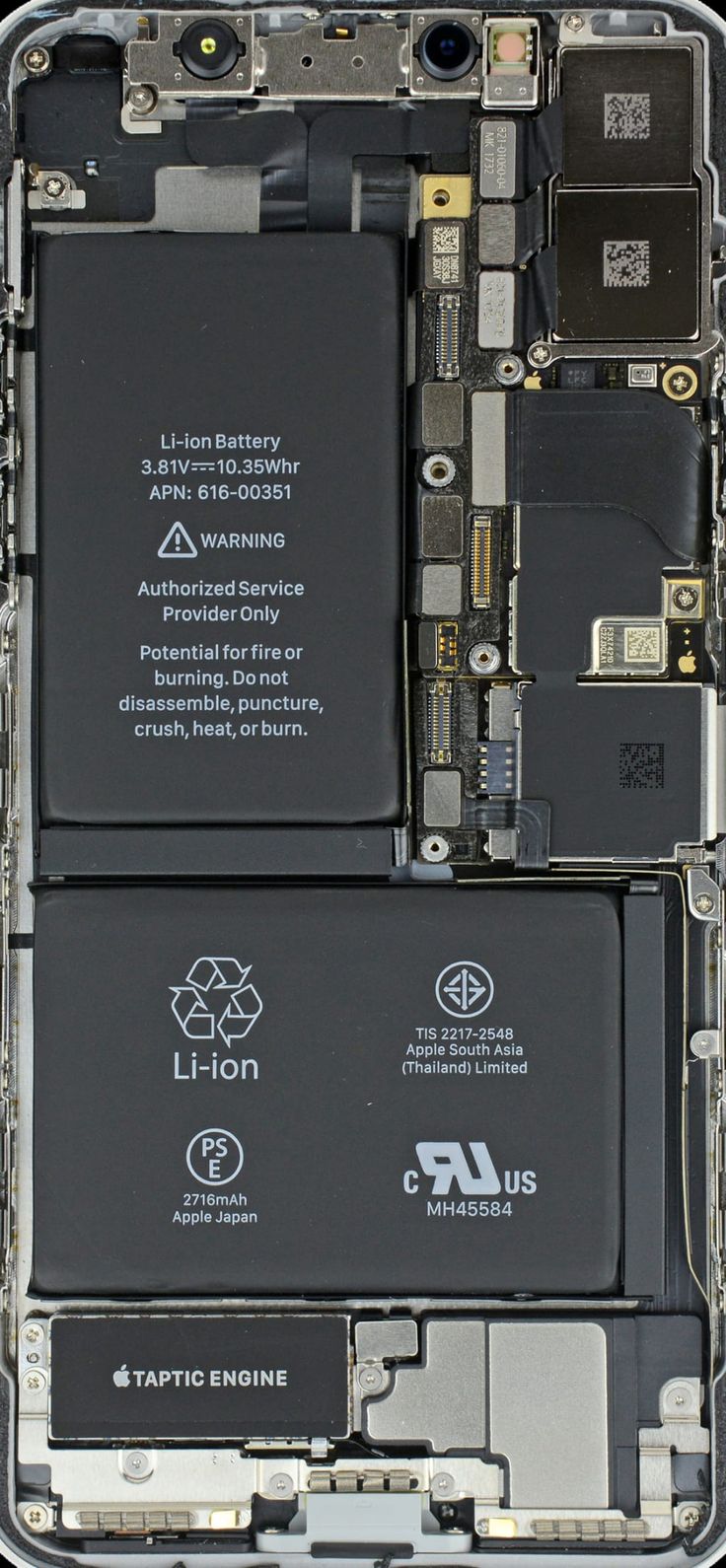 the back side of a cell phone with multiple components attached to it, including batteries and connectors