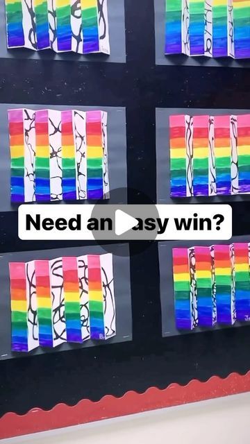 an art project with rainbows painted on the wall and words need an asy win?