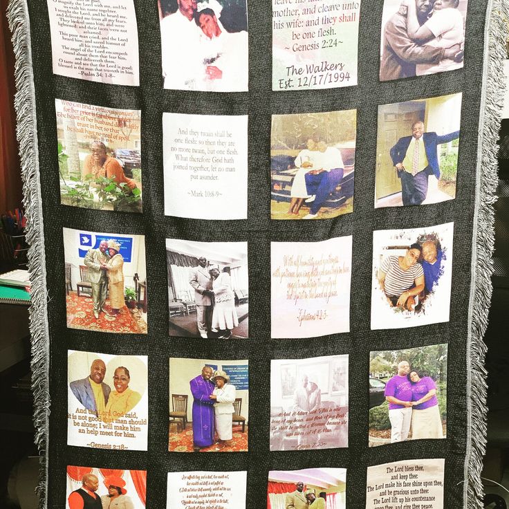 a black quilt with pictures of people and words on it, all written in different languages