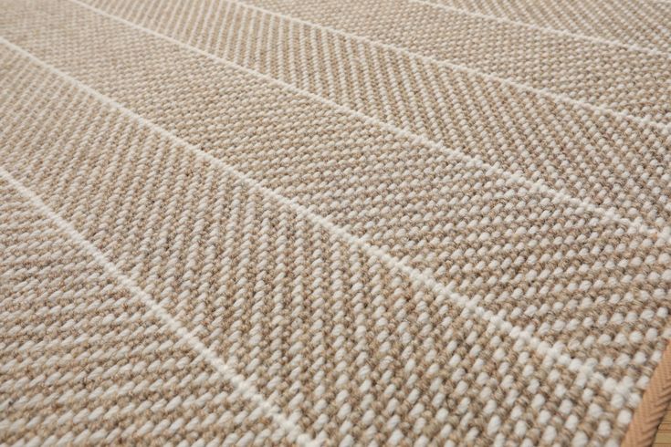 a close up view of a carpet with white lines on the top and bottom of it