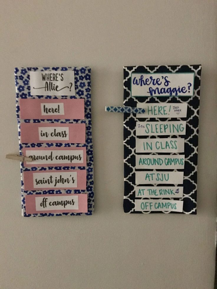 two magnets are hanging on the wall next to each other with words written on them