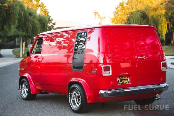 the red van is parked on the street