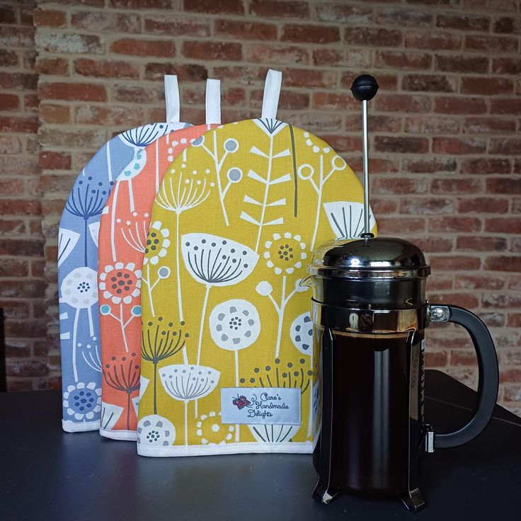 a coffee mug and tea bag sitting on a table