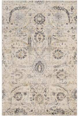 an area rug with many different colors and patterns on the carpet, including beiges, blue