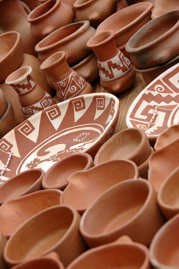 many clay bowls and plates are stacked on top of each other in rows royalty images