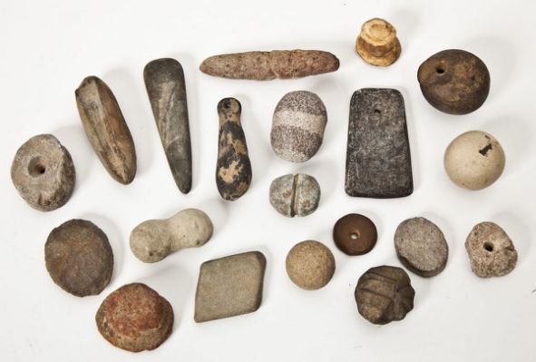 various rocks and stones laid out on a white surface