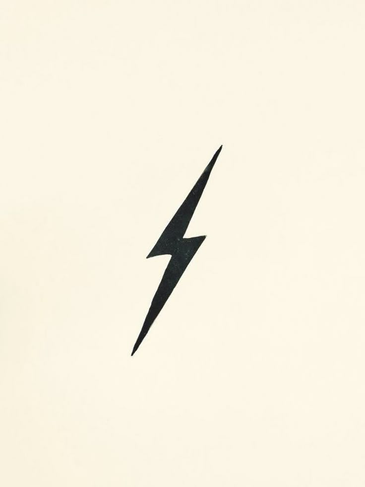 a black bird flying in the sky with a lightning bolt on it's side