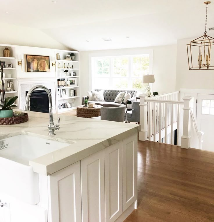 a large kitchen with an island in the middle