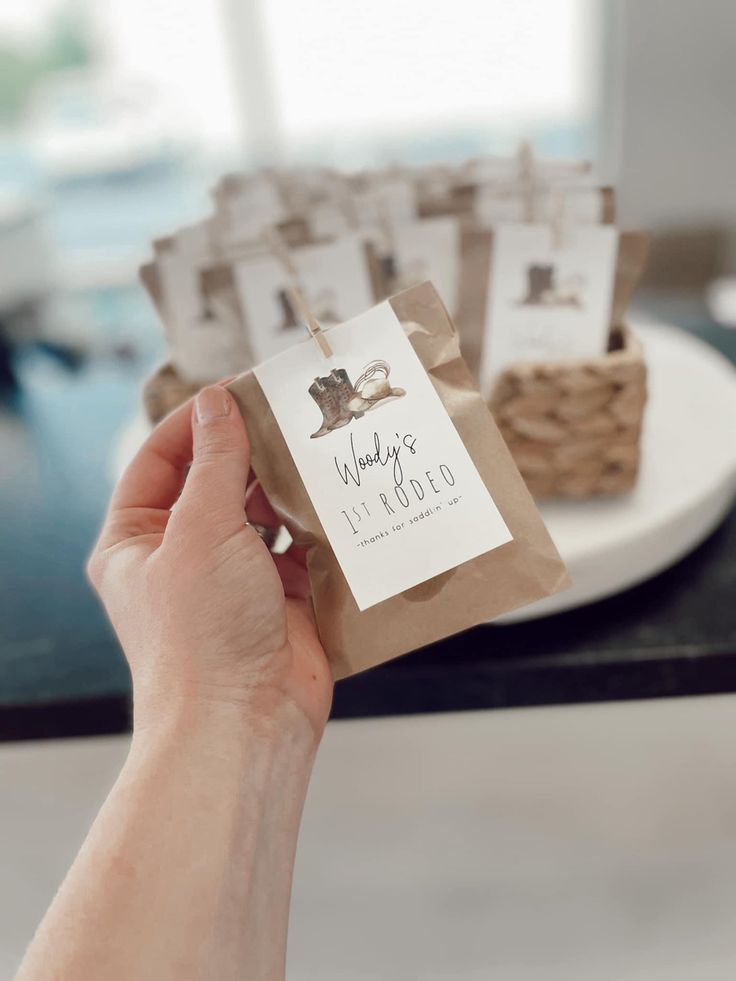 a person holding up some brown paper bags