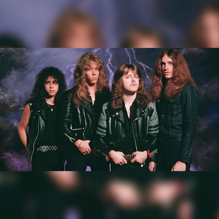 an image of four people standing in front of a wall with lightning coming out of it