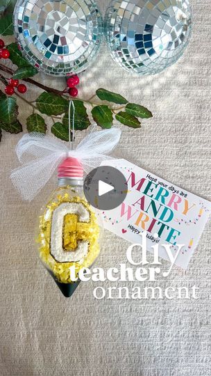 a christmas ornament hanging from the side of a tree with ornaments around it