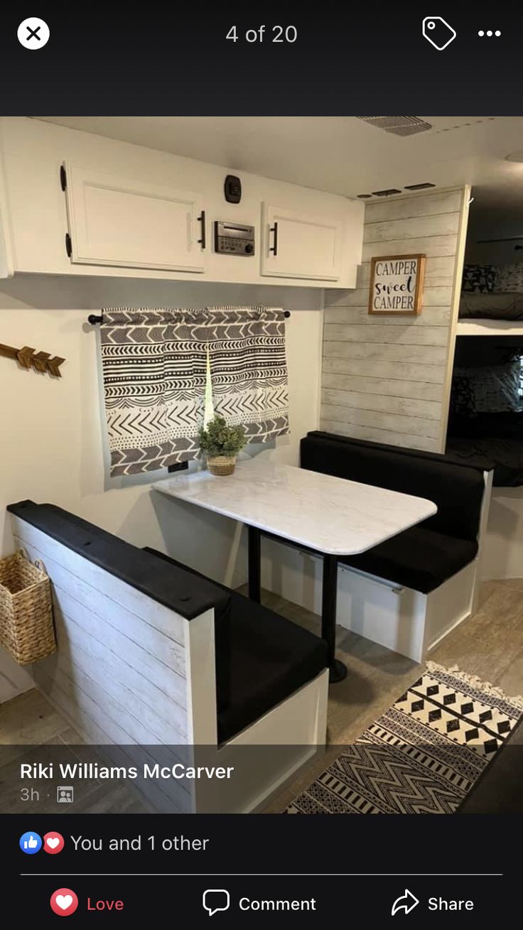 a small kitchen with white cabinets and black counter tops is featured on the instagram page