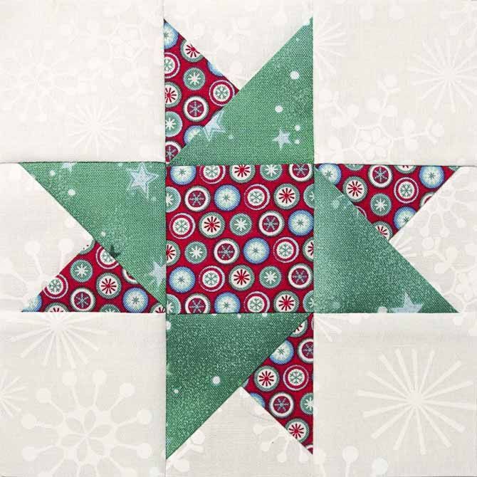 a green and red star quilt block